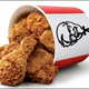 Product shot: KFC Bucket of Extra Crispy chicken laying on its side
